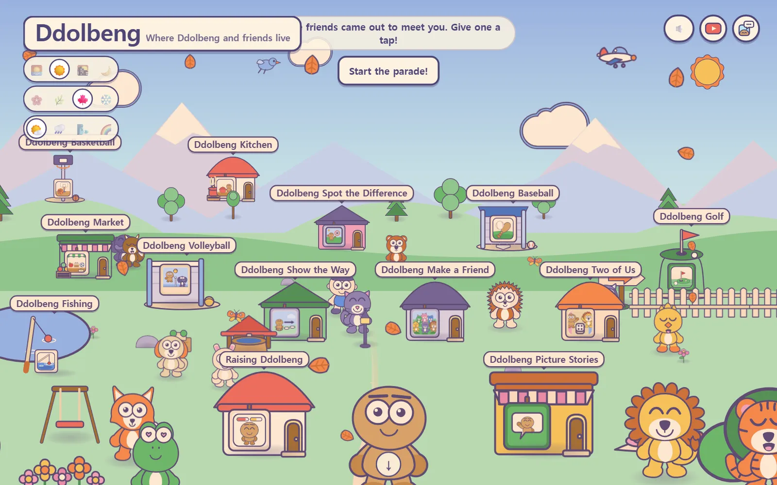 The Ddolbeng village in English: a sign reading "Where Ddolbeng and friends live," little houses with game names, and friends on the grass